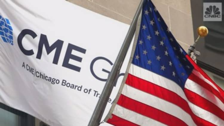 An image of the CME logo next to the American flag