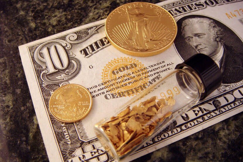 An image of a gold certificate and gold coins