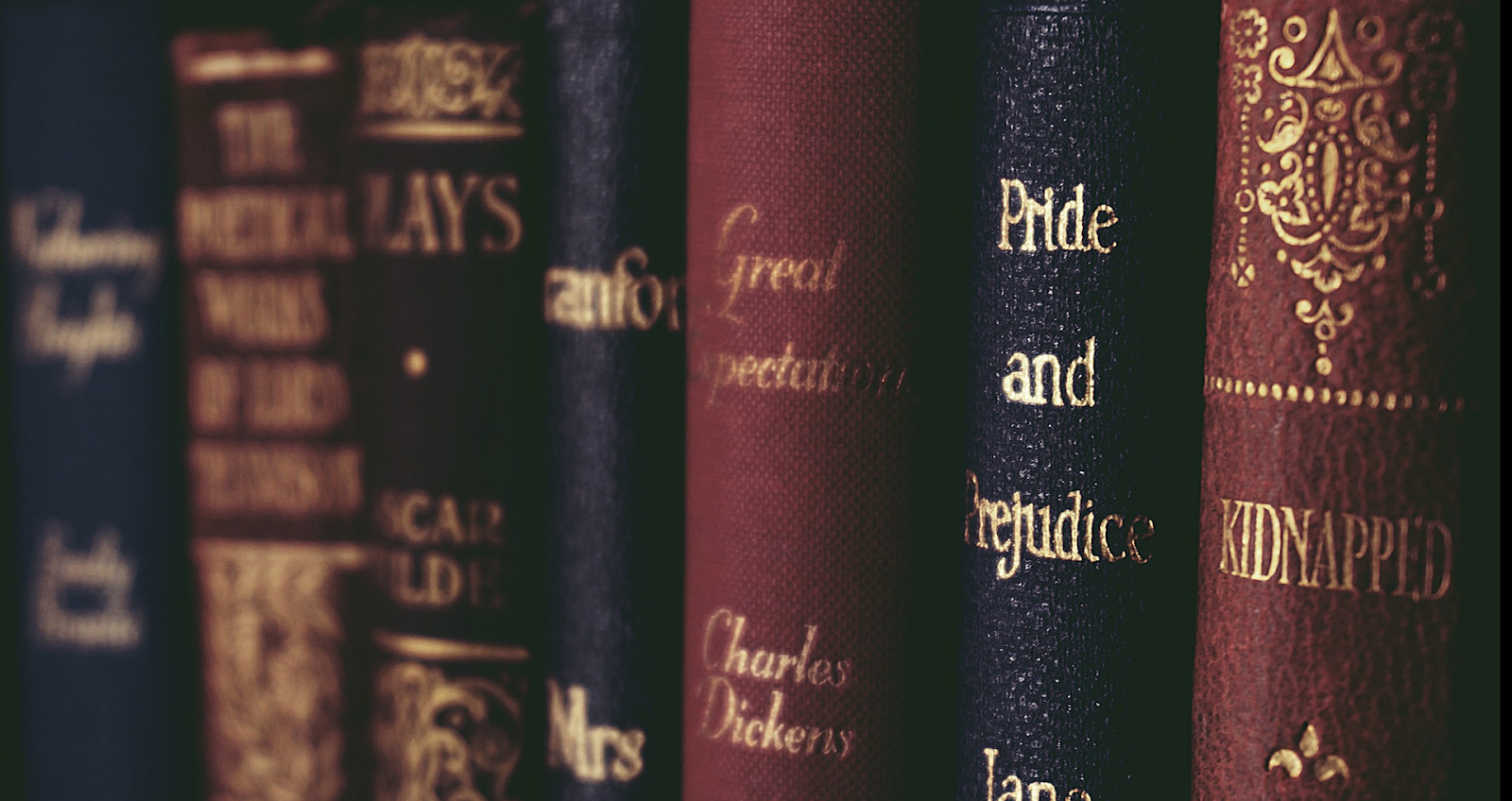 A picture of books on a shelf.